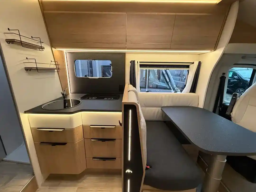 Camper Moovy - modern bright living area with dining table seating up to 6 people